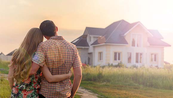 A happy couple who just became new home owners after a home inspection in the area of Jacksonville, North Carolina.